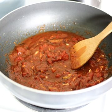 Process Shot: add tomatoes and tomato paste