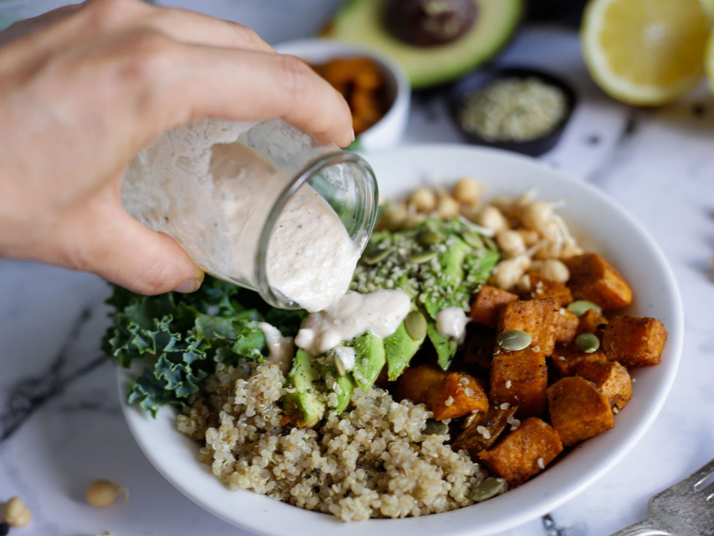 Dressing Poured over Sweet Potato Quinoa Bowl